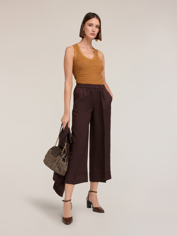 Top in maglia con bordi in paillettes