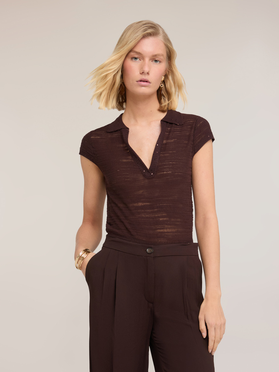 Polo in maglia con bordi in paillettes