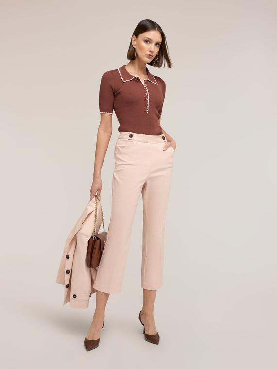 Polo in maglia fine con smerlo